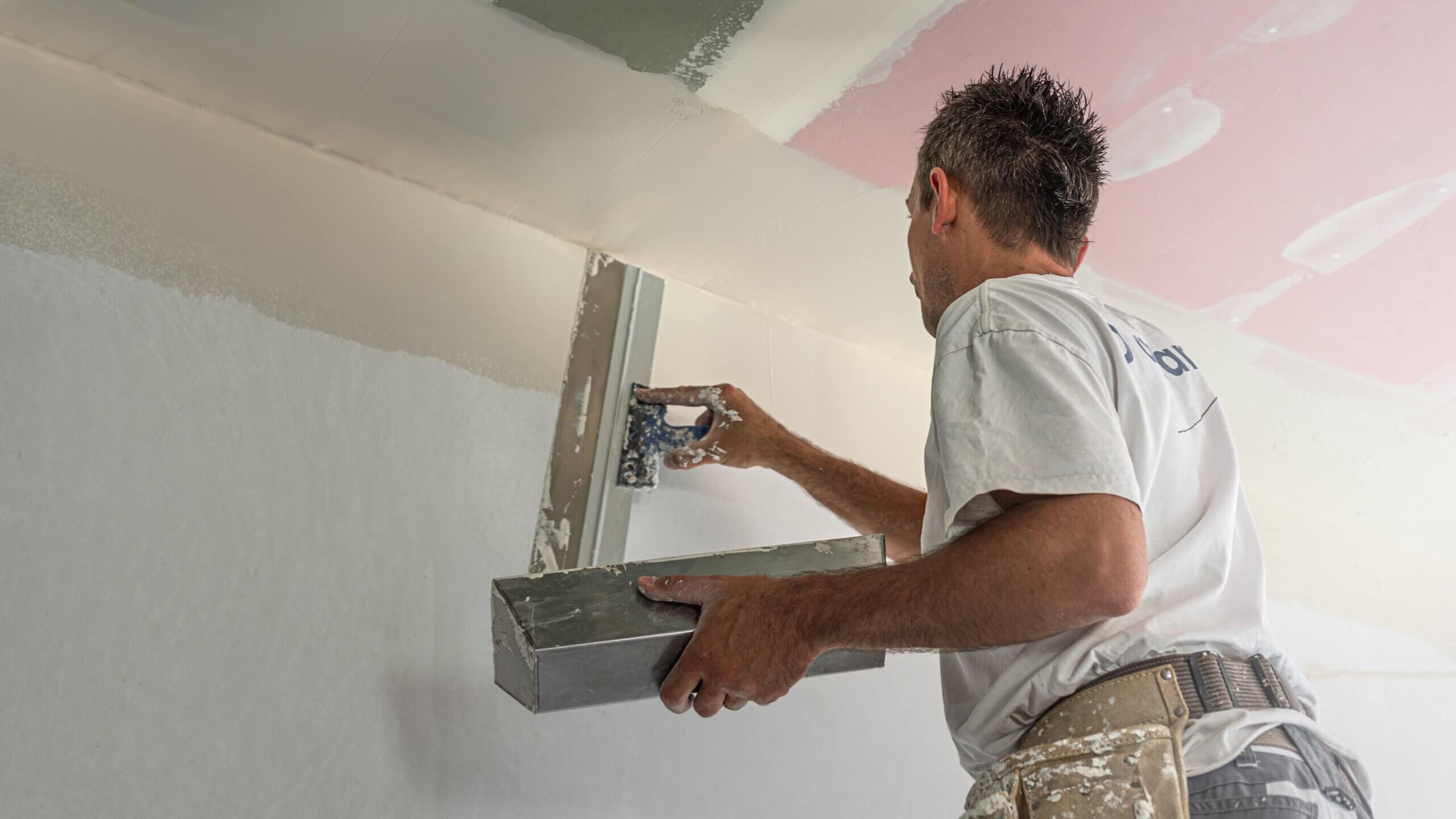 The,Worker,Make,A,Plasterboard,Ceiling.,He,Does,Taping,Plaster